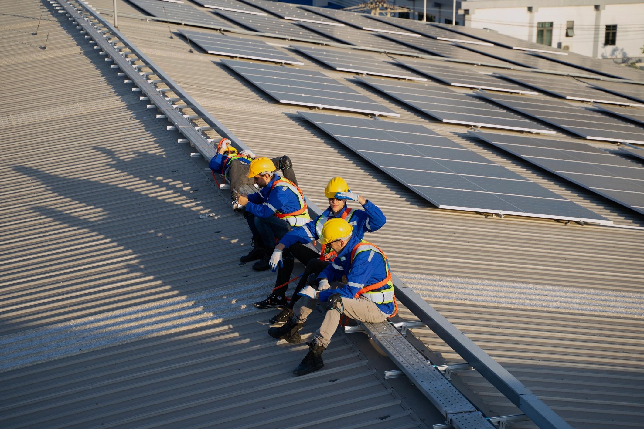 Roofing crew working together on a rooftop