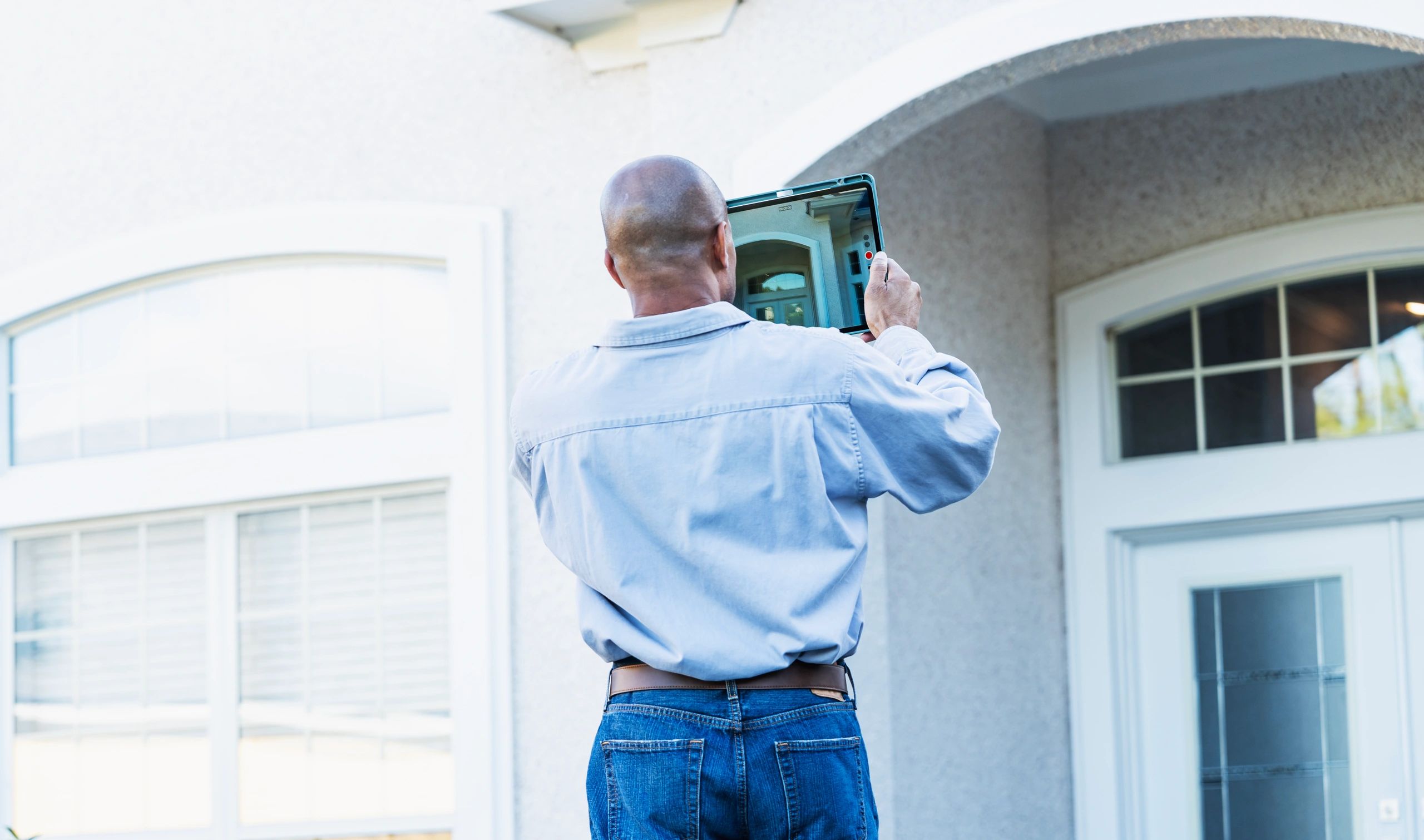 Homeowner during exterior inspection